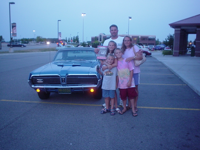 Rick Ohsiek & family enjoy their SF Outstanding Cruzer award for their 68 Cougar.
