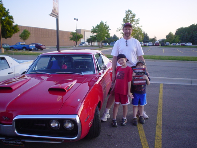 Ron Couts beams with pride with his boys with his Noonan GMC Best of Class award