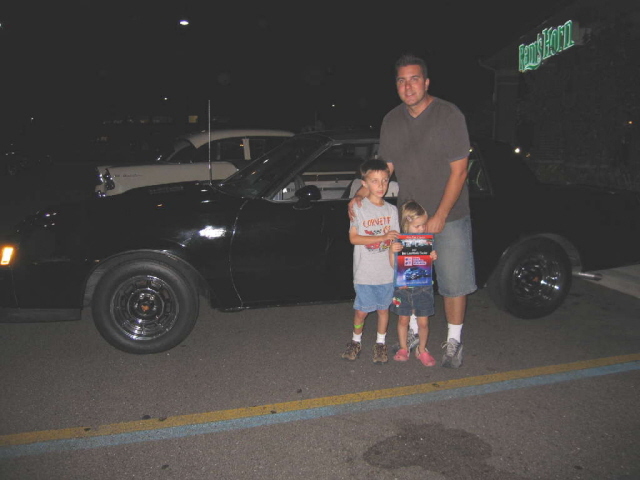 Steve Petro's family grasp the 4 Seasons Best Late Model plaque for his nice 87 Buick.