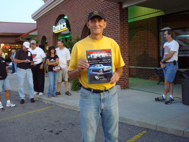 Rick Giffin shows off his Best Muscle Car plaque