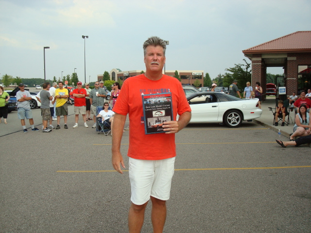Brian Olley holds the Rev Up Best Late Model Cruiser prize.