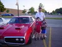 Ron Couts beams with pride with his boys with his Noonan GMC Best of Class award