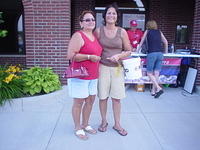 Denise' presents $50 to the MADD raffle money winner