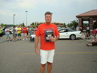 Brian Olley holds the Rev Up Best Late Model Cruiser prize.